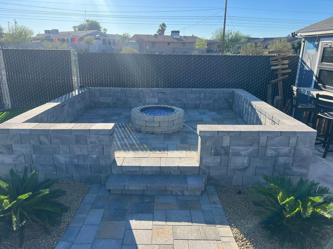 Fire Pit, Turf & Curved Seat Wall by Havasu Pavers in Lake Havasu City