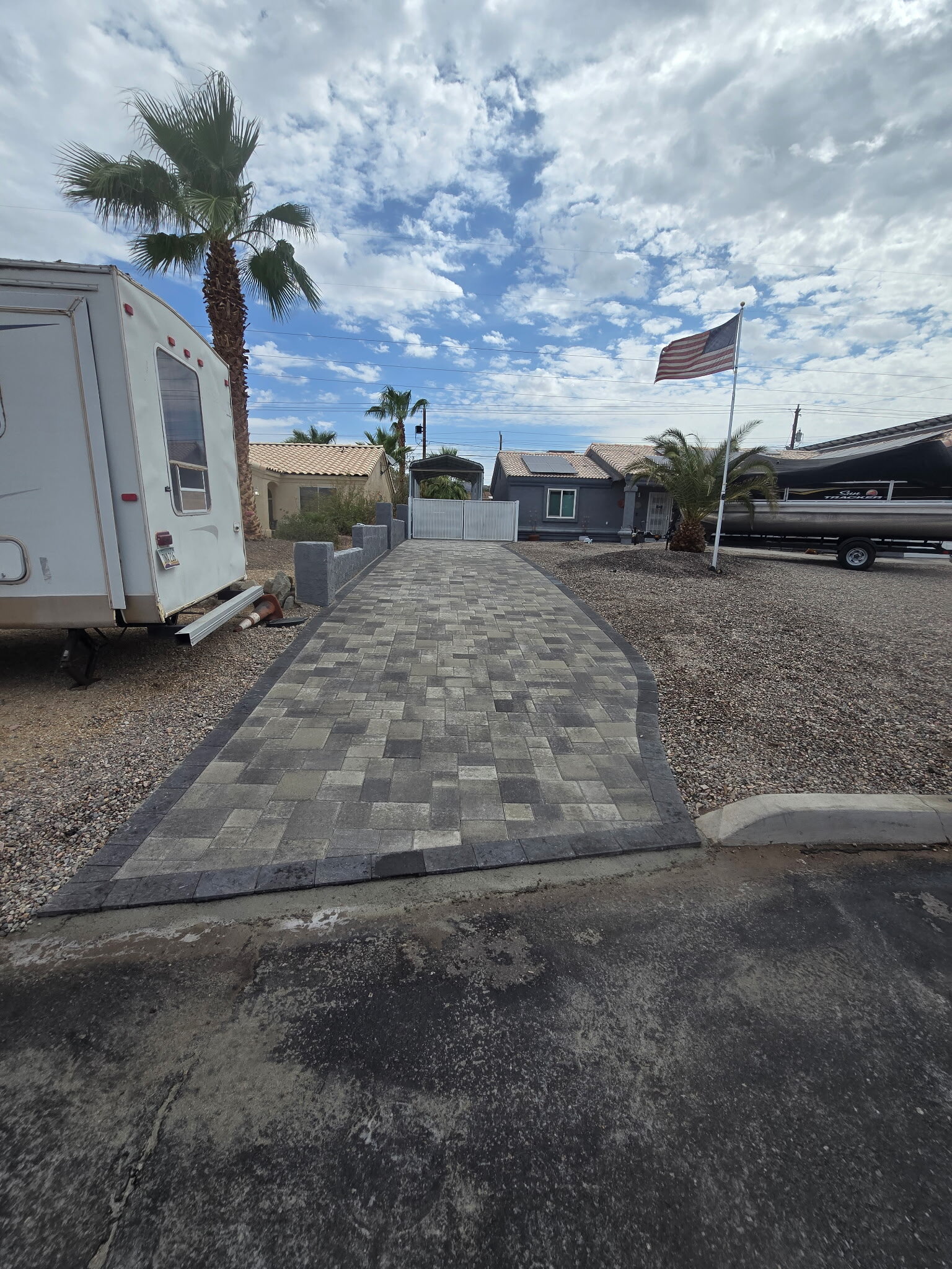 Grey Paver Driveway & Gated Parking by Havasu Pavers in Lake Havasu City