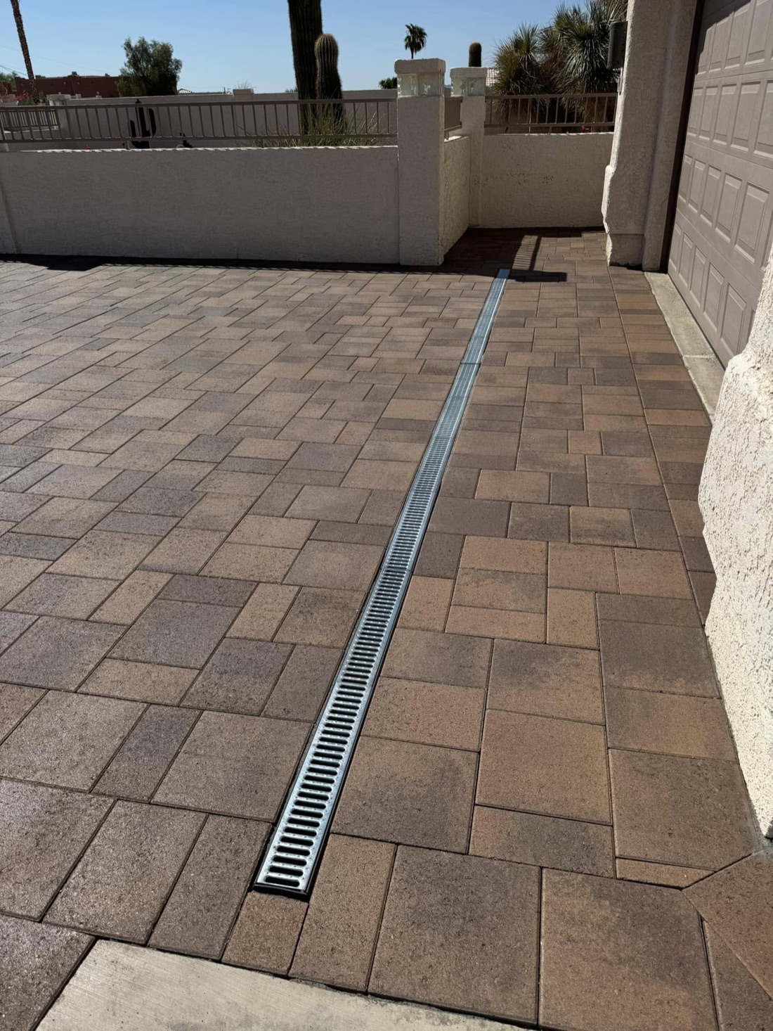 Grading project by Havasu Pavers in Lake Havasu City — Traffic-rated channel drain set in pavers